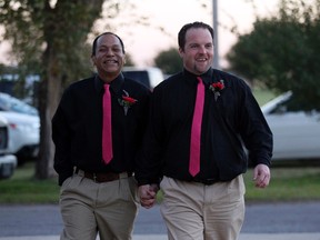 Darren Black Bear (L) and Jason Pickel arrive to be married by Darren's father Rev. Floyd Black Bear in El Reno, Okla.,October 31, 2013.