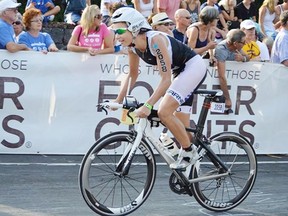 Stony’s Lindsay Adam wheels into the gruelling 112-mile bike portion of the Hawaiian Ironman triathlon, held in Kailua-Kona. The race, known as the world championship, was won by Stony Plain’s Heather Fuhr in 1997. - Gord Montgomery, Reporter/Examiner