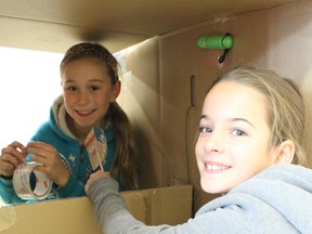 In preparation of the cardboard challenge on Oct. 30, Holly Tuininga and Gabrielle Wood, both Grade 4 students, built their cardboard game, Fly Your Own Airplane, on Oct. 29. The girls’ game incorporated various mechanical components challenging students to keep their “airplanes” in flight for as long as possible. - Karen Haynes, Reporter/Examiner