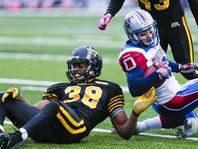 Hamilton Tiger-Cats Marcellus Bowman and Montreal Alouettes Bo Bowling during 2nd half CFL action at Alumni Stadium in Guelph, Ont. on Saturday October 26, 2013. Ernest Doroszuk/Toronto Sun/QMI Agency