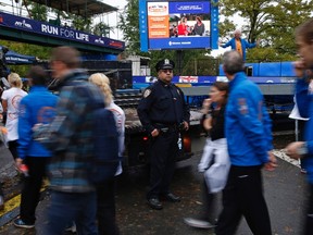 NYC Marathon will be monitored by bomb-sniffing dogs, police scuba divers and surveillance helicopters to prevent an attack similar to the Boston race.

REUTERS/Mike Segar