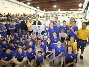 It was smiles all around for all hands on deck Saturday in the Tillsonburg Complex Pool as a $35,000 Trillium Foundation grant was official acknowledged. The money went toward six contemporary starting blocks and a portable accessibility feature. Among those official sharing in the ceremony, were (holding the foundation flag in the back row, left to right) Deputy Mayor Mark Renaud, Trillium Foundation Grant Review Board member Brian George, Oxford MPP Ernie Hardeman and SWA President Liam McCreery. Jeff Tribe/Tillsonburg News