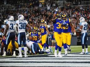 Rams running back Zac Stacy celebrates one of his two TDs against the Titans on Sunday. (USA TODAY SPORTS)