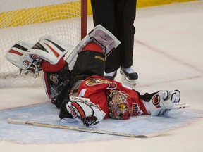 Ottawa Senators goalie Craig Anderson (41) lies on the ice is discomfort after a collision with Dallas Stars right wing Valeri Nichushkin (not pictured) in overtime at the Canadian Tire Centre. The Stars defeated the Senators 3-2 in a shootout. Mandatory Credit: Marc DesRosiers-USA TODAY Sports