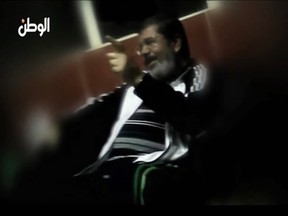A still image taken from video released by Egypt's Al Watan newspaper shows what the newspaper says is ousted former Egyptian leader Mohamed Mursi speaking to unidentified individuals whilst in prison. (REUTERS/Al Watan Newspaper via Reuters TV)