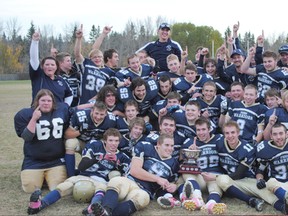 The Frank Maddock High School Warriors football team was all smiles after winning the Mountain View Football Conference Championship Oct. 26 in Red Deer. Displaying the top-notch play that has characterized their undefeated 2013 season, the Warriors bested the Didsbury Dragons 60-8 to capture the championship trophy.