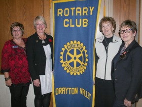 Left to right: Kelly Starling, president of the Rotary Club of Drayton Valley, award recipient Pat Vos, award recipient Lil Ross, Rotary District Governor Betty Screpnek.