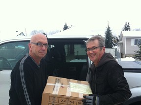 Phil Bell and Lyndon Muth help transport Christmas Child shoeboxes from Drayton Valley to Edmonton in 2012.