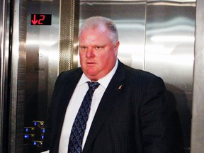 Mayor Rob Ford arrives at his office at Toronto City Hall on Monday. (STAN BEHAL/Toronto Sun)