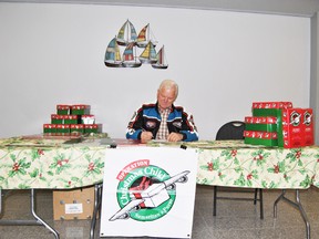 Dave Giesbricht, an Opertation Christmas Child volunteer mans the booth in Midtown mall on Thursday, Oct. 31. 
Barry Kerton | Whitecourt