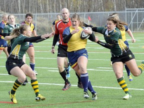 The Queen's Golden Gaels, in action against Alberta on Saturday, won the bronze-medal game Sunday at the Canadian Interuniversity Sport women's rugby championship tournament in Laval, Que. (QMI Agency)