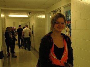 Central Elgin Collegiate Institute Grade 12 student Lindsey Hill pauses in the hall at her school during a university information program on Monday. The program invited about 500 area students to hear presentations from 21 Ontario universities. Hill and her classmates will be unable to complete a fifth-year "victory lap" in high school next year due to new provincial regulations.