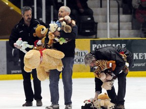 Teddy bears are scooped off the PCU Centre ice during last year's first ever Teddy Bear Toss. The event is back for a second year on Nov.17. (File photo)
