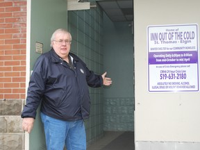 Jim Nace, program director for the Inn Out of the Cold seasonal homeless shelter, holds open the door to the shelter. The shelter is run out of the basement of Central United Church in St. Thomas and is open every night until around the middle of April. (Ben Forrest, Times-Journal)