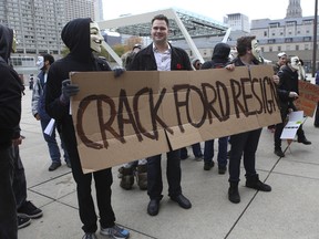 Protestors gather outside City Hall after the Mayor Rob Ford admitted he has smoked crack cocaine. (JACK BOLAND/Toronto Sun)