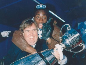 Toronto Argos part-owner John Candy hoists Raghib "Rocket" Ismail after winning the 79th Grey Cup. Ismail is one of the guests at the coming Sports Spectacular set for Jan. 23.  (QMI Agency file photo)