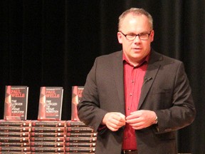 Political writer Paul Wells speaks about his new book, "The Longer I'm Prime Minister, Stephen Harper and Canada, 2006-” at the Sarnia Library theatre Wednesday. The Sarnia native said he tried to write about the prime minister in a way that appeals to all people.  TYLER KULA/ THE OBSERVER/ QMI AGENCY