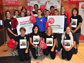 A team of Canada Revenue Agency employees poses for photos at the Scotiabank StairClimb for United Way at One London Place Nov. 7, 2013 in London Ont. CHRIS MONTANINI\LONDONER\QMI AGENCY