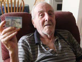 Sarnia, Ont. man Jim Ruttan, 83, sits with his expired Ontario driver's licence. Ruttan says government-required retesting every two years for any driver who's 80 years or older is discriminatory. On Thursday the provincial government announced it will eliminate the written test drivers over 80 have been required to take every two years to renew their driver's licences.
TYLER KULA/Sarnia Observer/QMI Agency file photo