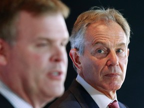 Quartet Representative and former British prime minister Tony Blair, right, takes part in a news conference with Canada's Minister of Foreign Affairs John Baird in Ottawa on Oct. 17.     
REUTERS/QMI Agency