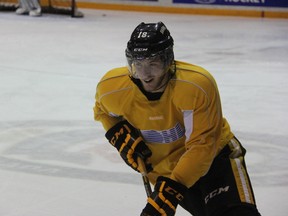 Sarnia Sting forward Bryan Moore is all smiles as he skates up the ice at practice on Wednesday, Nov. 6. Despite Moore's 2 goal performance against the Niagara IceDogs on Thursday night, the Sting didn't have anything to smile about as they fell 6-3. (SHAUN BISSON, The Observer)