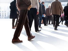 The group of people walking to their jobs. (Fotolia.com)