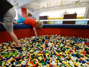 Children play with Lego blocks in the lobby of North America's first ever Legoland Hotel at Legoland on September 17, 2013 in Carlsbad, California. The three-story, 250-room hotel is located at the entrance of Legoland California theme park.   Kevork Djansezian/Getty Images/AFP