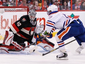 Ottawa Senators' goaltender Robin Lehner gets across his net to stop Edmonton Oilers David Perron during NHL hockey action at the Canadian Tire Centre in Ottawa on Saturday October 19,2013. Errol McGihon/Ottawa Sun/QMI Agency