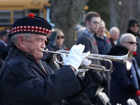 Bugler Bob Murray plays last Post during the Cataraqui Cemetery Day of Remembrance Service near the graves of fallen soldiers in Kingston on Friday.
IAN MACALPINE/KINGSTON WHIG-STANDARD/QMI AGENCY