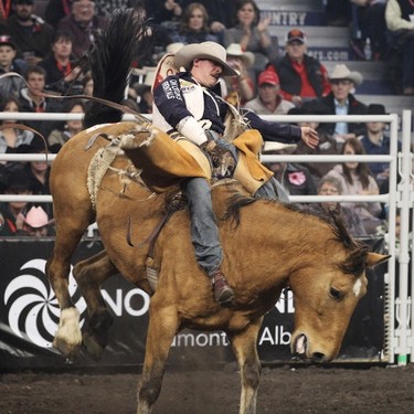 Matt Lait rides in the bareback event during Canadian Finals Rodeo at Rexall Place in Edmonton, Alta., on Friday, Nov. 8, 2013.  The CFR continues through Nov. 10. Ian Kucerak/Edmonton Sun/QMI Agency