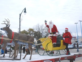 Santa waves from his sleigh Saturday at the Dutton Santa Claus parade.
PATRICK BRENNAN The Chronicle