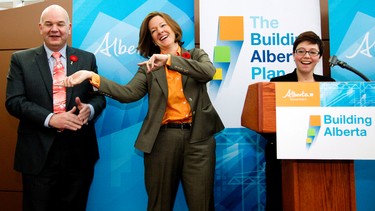 Health Minister Fred Horne, left to right, Premier Alison Redford, and double-lung transplant recipient H�l�ne Campbell, dance at Campbell's request during a press conference at the Kaye Edmonton Clinic in Edmonton, Alta. on Friday, Nov. 8, 2013. The province has passed Bill 207 to increase organ and tissue donation in Alberta with measures like an online registry and donor status being included with driver's lisence renewals. Amber Bracken/Edmonton Sun/QMI Agency