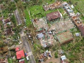 An aerial view shows damaged houses after Typhoon Haiyan hit Iloilo Province, central Philippines November 9, 2013.  REUTERS/Raul Banias
