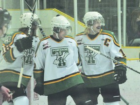 (L-R) Dexter Kuczek, Davis Ross and Brent Wold celebrate a Terriers goal during a 7-2 win over Winkler Nov. 9 (Kevin Hirschfield/THE GRAPHIC/QMI AGENCY)