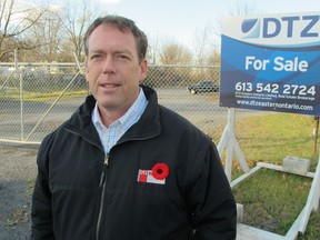 Martin Skolnick of DTZ stands in front of a for sale sign, advertising a 5.7-acre piece of land fronting on Cataraqui Street, owned by the Koven family through their business Rosen Energy Group Inc. The property is the preferred site for the Wellington Street extension.
Paul Schliesmann/Whig-Standard