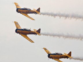 Harvard airplanes perform at an airshow in Brantford.
QMI Agency