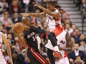 Raptors’ Kyle Lowry (right) defends against Heat guard Ray Allen. Lowry sprained his ankle against the Jazz on Saturday night, but should be able to go tonight against the Rockets. (USA Today)