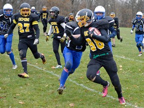 Gemini's Luke Collver, who stripped the ball off an IDCI player in the second half of Thursday's TVRA varsity semifinal, works his way to the sidelines. CHRIS ABBOTT/TILLSONBURG NEWS