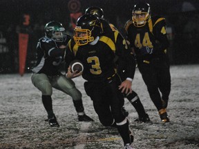 Keith Dempsey/For The Sudbury Star 
Lively Hawks' Scott Friesen looks for a gap in West Ferris Trojans to open up during NOSSA senior football semifinal action on Saturday at James Jerome Sports Complex. North Bay's Trojans blanked the Hawks 23-0.