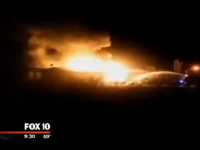 An Arizona man received a surprising $19,825 bill from a nearby fire department after his home burned down. This is a neighbour's videoclip of the fire. (Screengrab/Fox10)