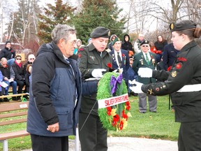 Jim Young, nephew of Franklin Leroy Travers of Talbotville, who died while on an RCAF submarine attack mission in 1943, places the wreath on behalf of Silver Cross families at the Southwold Remembers service Sunday in Shedden.