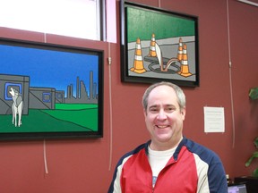 Richard Bangma, Whitecourt and District Public Library, director poses beside two of Jason Carter’s paintings now on display at the library as part of Urban Animals exhibit from the Art Gallery of Alberta.
Celia Ste Croix | Whitecourt Star