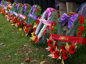 Wreaths adorn the cenotaph in St. Thomas