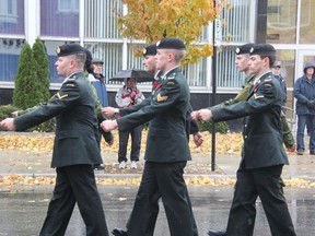 Members of the 1st Hussars march through downtown Sarnia Monday, Nov. 11, 2013. (BARBARA SIMPSON, The Observer)