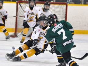 Jacob Rauser of the Mitchell Pee Wees slides to attempt to block this slapshot from this Mount Forest opponent during action from the 58th annual Mitchell Pee Wee hockey tournament last Friday, Nov. 8. The Meteors won 2-0, but were eliminated in the semi-final Saturday evening. ANDY BADER/MITCHELL ADVOCATE