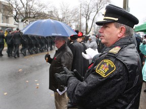 Kingston Fire Chief Rheaume Chaput watches a Remembrance Day Ceremony.
Michael Lea/Whig-Standard file photo