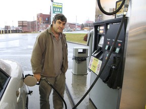 JOHN LAPPA/THE SUDBURY STAR
Joe Roque fills his vehicle with gas at a gas station on Lorne Street in Sudbury on in this file photo. Some motorists are frustrated by the difference in gas prices across northeastern Ontario.