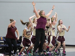 Regiopolis-Notre Dame Panthers coach Lesley Stevenson and players jump for joy after a last-second basket by Rebecca Wendland beat the La Salle Black Knights 34-33 in the Kingston Area Secondary Schools Athletic Association senior girls basketball championship  game at Queen's University's Athletic and Recreation Centre Monday night. (Ian MacAlpine/The Whig-Standard)