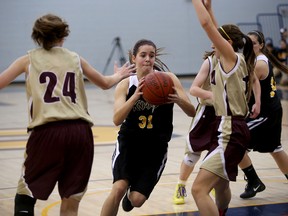 LaSalle Black Knights Lillie Dixon drives between two Regiopolis-Notre Dame Panthers  including Rebecca Wendland (left) in the Kingston Area Secondary Schools Athletic Association senior girls championship final game at The Queen's Athletic and Recreation Centre in Kingston on Monday. The Black Knights bounced back after losing this game to win four straight at the AA EOSSAA tournament and advance to the provincials.
IAN MACALPINE/KINGSTON WHIG-STANDARD/QMI AGENCY