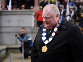 Toronto Mayor Rob Ford walks back to his chair during Remembrance Day ceremonies at Old City Hall in Toronto November 11, 2013.  (REUTERS/Aaron Harris)